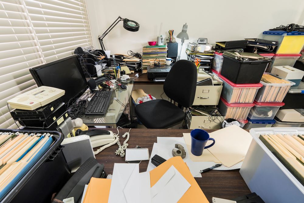 messy office with lots of clutter