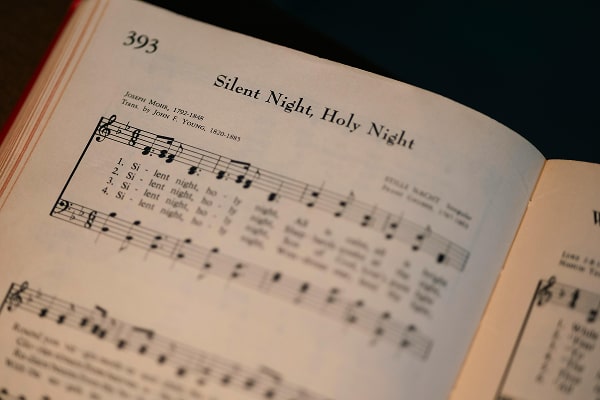 Close up of a sheet of music: "Silent Night” Christmas carol.